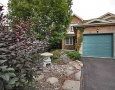 Great Curb Appeal from this Fully Landscaped Yard